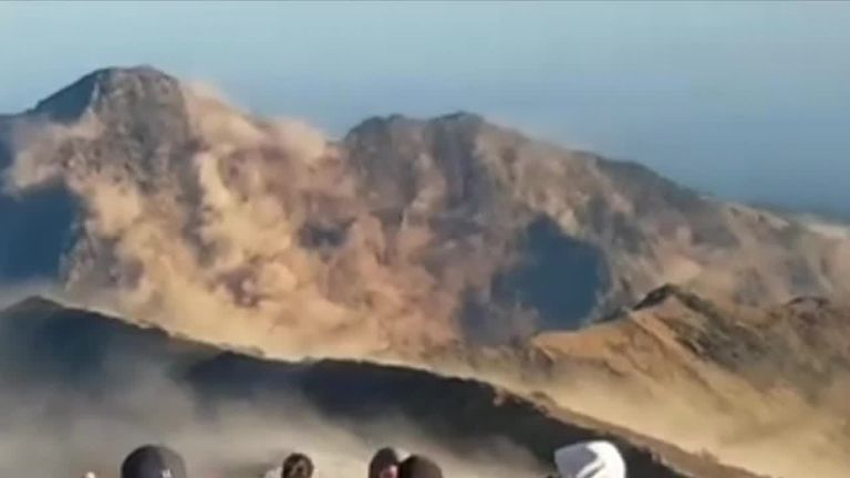 Hikers descend mountain