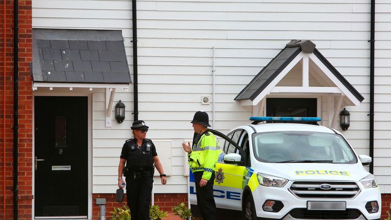 Police officers outside a residential address in Amesbury