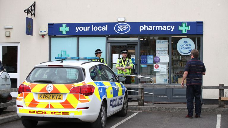 Police officers stand outside Boots pharmacy, near to the Barcroft Medical Centre in Amesbury, Wiltshire, where a major incident has been declared after it was suspected that two people might have been exposed to an unknown substance. PRESS ASSOCIATION Photo. Picture date: Wednesday July 4, 2018. Police say that the man and woman, both in their 40s, are in a critical condition at Salisbury District Hospital. See PA story POLICE Amesbury. Photo credit should read: Yui Mok/PA Wire