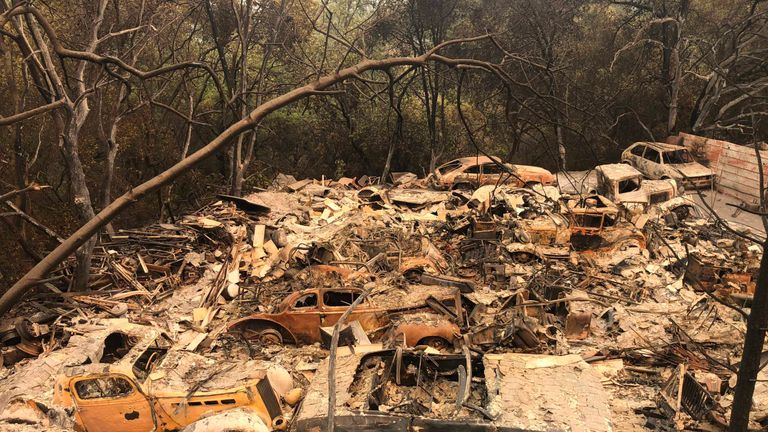 Classic cars - part of a collection - in a devastated area of Redding
