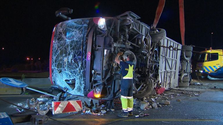The underside of the coach being examined after the crash
