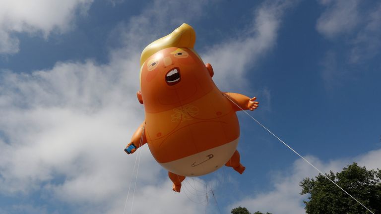 Demonstrators float a blimp portraying U.S. President Donald Trump above Parliament Square
