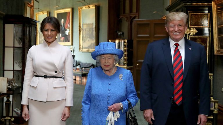 Queen Elizabeth II stands with US President Donald Trump and his wife, Melania, during their visit to Windsor Castle 