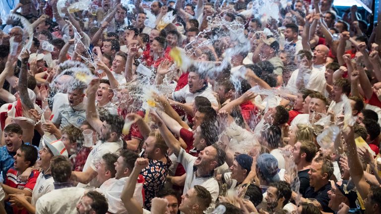 England fans celebrate as England score the second of their two goals against Sweden as they watch the World Cup quarter finals at Ashton Gate World Cup fans village at the Bristol City football club on July 7, 2018 in Bristol, England. Millions of fans will be supporting England today as the quarter-final match kicks off in the Russian city of Samara. England have not reached the last four in a World cup for 28 years with only one World Cup win in 1966. (Photo by Matt Cardy/Getty Images)