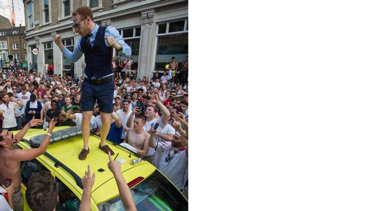 A man wearing a Gareth Southgate style waistcoat was seen on the ambulance roof