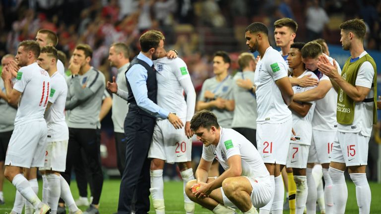 England&#39;s Harry Maguire (front) reacts along with teammates at the end of the 2018 World Cup semi-final football match between Croatia and England