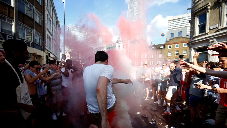 England fans set off smoke bombs after the match