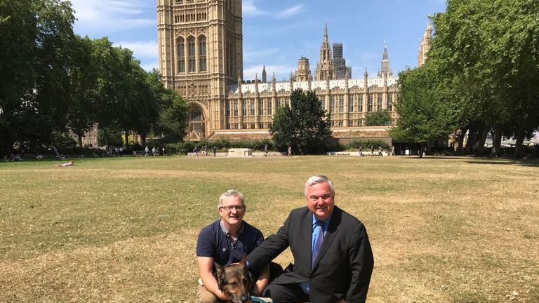 PC Dave Wardell's life was saved when his dog, Finn, almost died while chasing a robbery suspect who stabbed him in the head and chest.