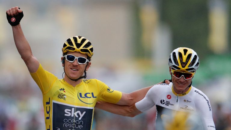 Team Sky rider Geraint Thomas of Britain, wearing the overall leader&#39;s yellow jersey, celebrates as he finishes with teammate Chris Froome