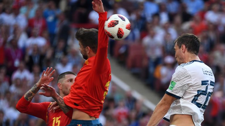 Spain's Gerard Pique handles the ball in the box to concede a penalty