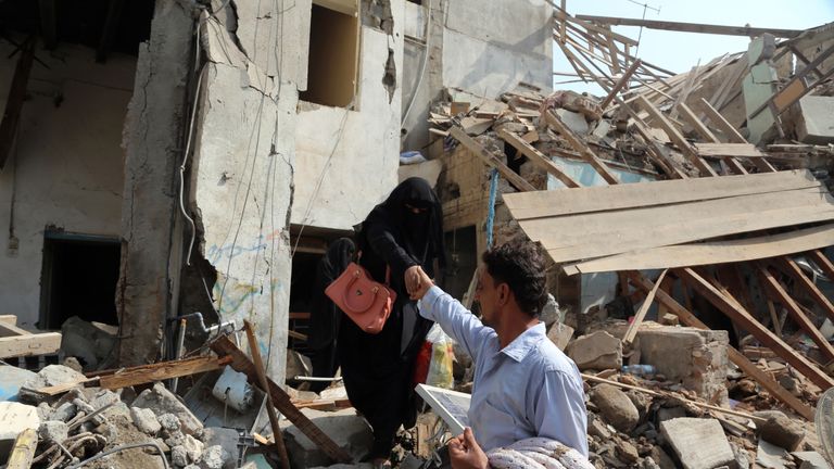 Yemenis make their way through the rubble of buildings destroyed during Saudi-led air strikes the previous day, on September 22, 2016 in the port city of Hodeida