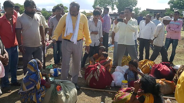 Indian village leaders speak to the relatives of men killed in a lynching incident in Dhule district on 1 July