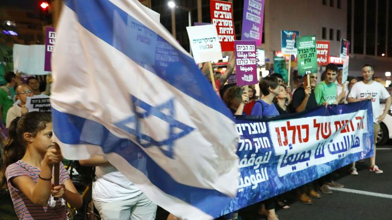 Demonstrators attend a rally to protest against the Jewish Nation-State Bill