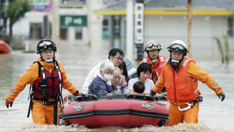 Residents are rescued from a flooded area at a hospital in Kurashiki, Okayama 