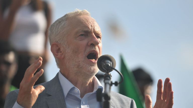 Jeremy Corbyn speaks to demonstrators marching through London during protests against the visit of Donald Trump