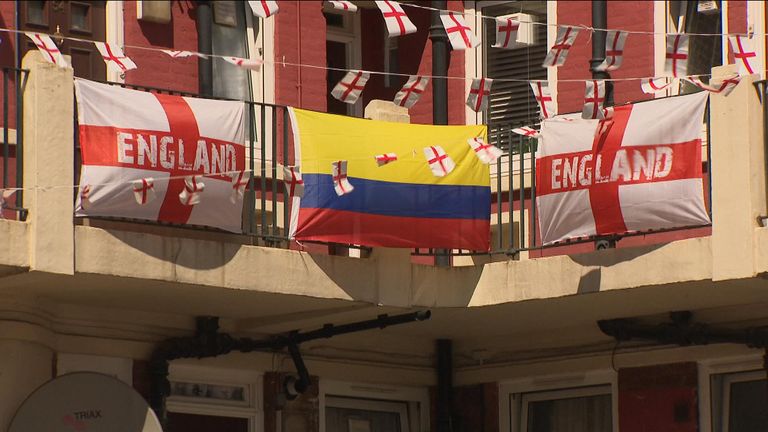 A Colombia flag amid two England ones on the Kirby estate in south London