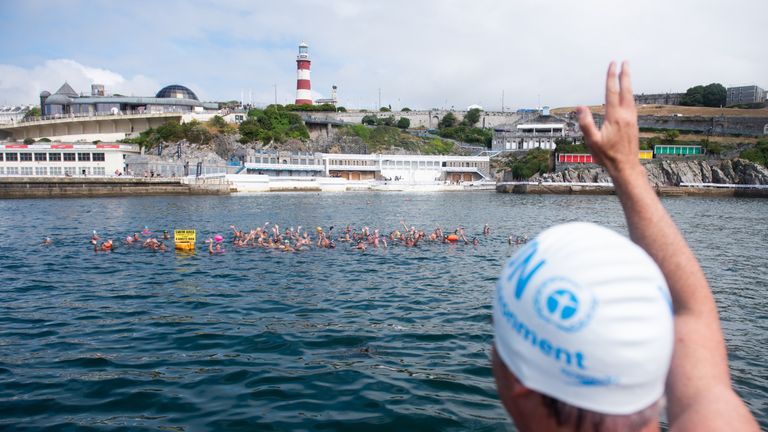 Lewis Pugh waves to swimmers in Plymouth