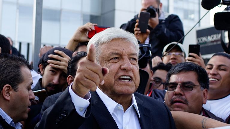 Presidential candidate Andres Manuel Lopez Obrador talks to reporters as he departs after casting his ballot at a polling station during the presidential election in Mexico City, Mexico, July 1, 2018