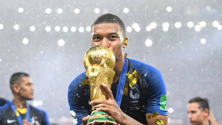 Kylian Mbappe of France celebrates with the World Cup trophy