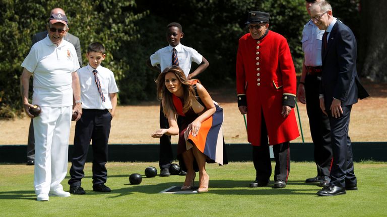 First Lady Melania Trump and Philip May, the husband of Britain&#39;s Prime Minister Theresa May, take part in a game of bowls with veterans and schoolchildren during a visit to the Royal Hospital Chelsea in London, Britain