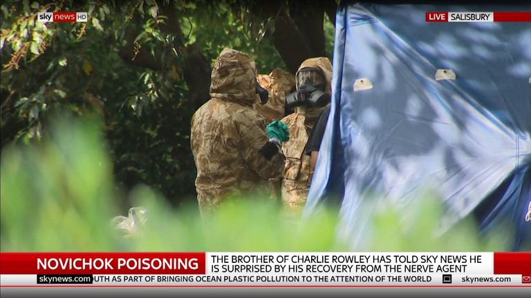 Forensic teams in protective clothing at Queen Elizabeth Gardens