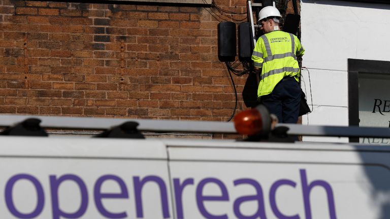 A BT openreach engineer works on a telephone line in Manchester northern England.