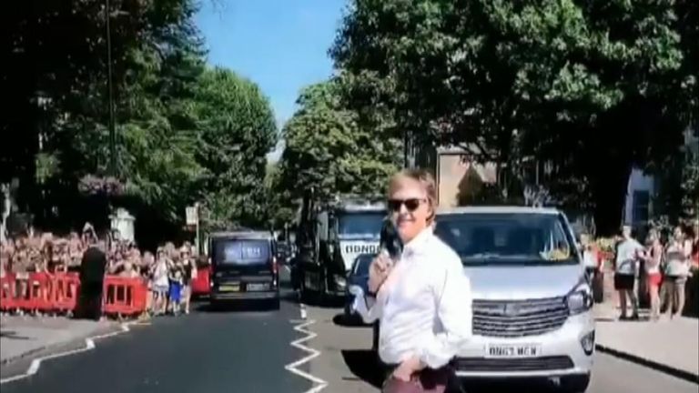 Paul McCartney recreates iconic Beatles album cover by crossing Abbey Road again 49 years later