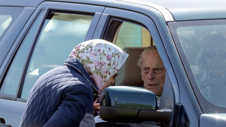 Queen Elizabeth II talking to the Duke of Edinburgh during the Royal Windsor Horse Show at Windsor Castle in May 2018