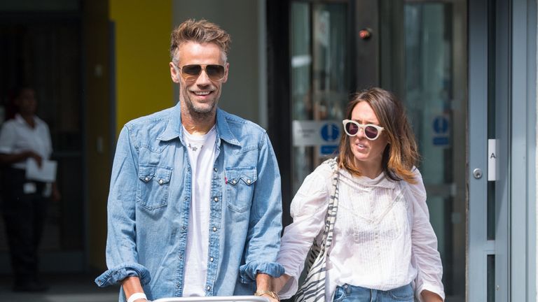 Richard Bacon leaves Lewisham Hospital in south east London with his wife Rebecca