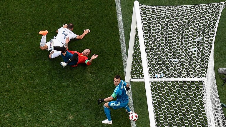 Sergei Ignashevich deflects a Marco Asensio free-kick into his own net