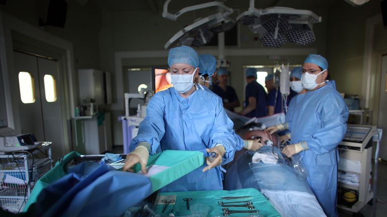 A surgeon and his theatre team perform key hole surgery to remove a gallbladder at at The Queen Elizabeth Hospital on March 16, 2010 in Birmingham, England