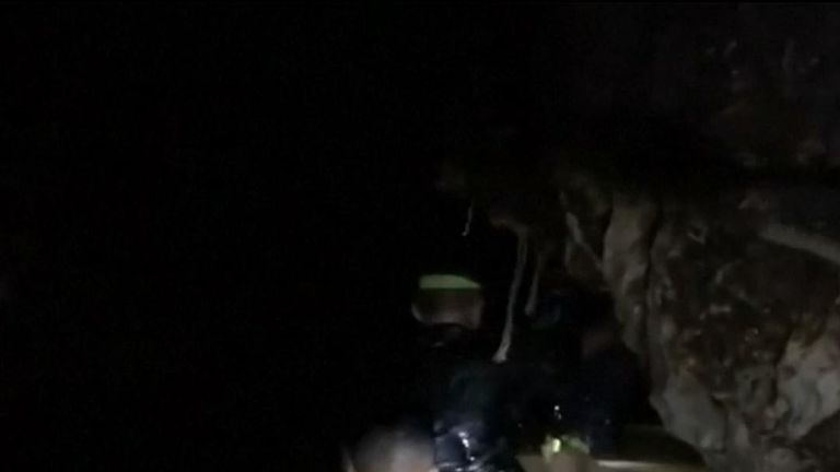 Billionaire Elon Musk filmed rescuers wading through water in a Thai cave where four boys and their soccer coach still remain