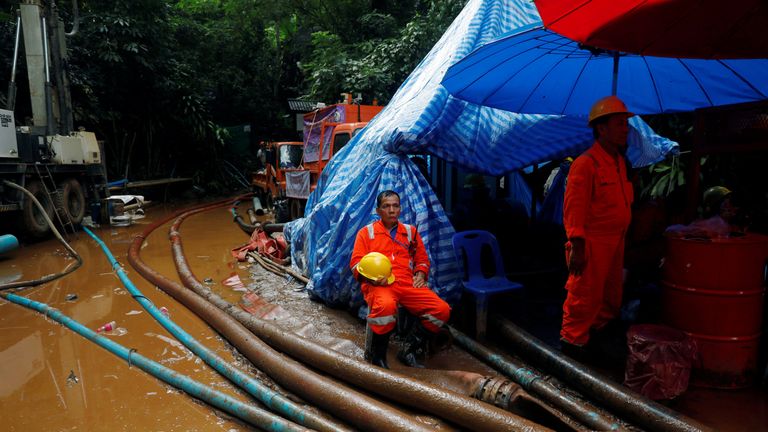 Rescue workers in front of the Tham Luang cave complex