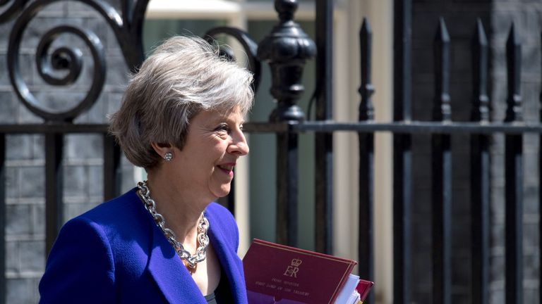 Theresa May leaves Downing Street in Westminster to attend Prime Minister&#39;s Questions at the Commons