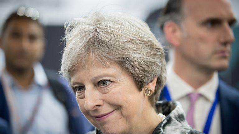 FARNBOROUGH, ENGLAND - JULY 16: British Prime Minister Theresa May speaks with guests as she opens the Farnborough Airshow on July 16, 2018 in Farnborough, England. Theresa May opened the Farnborough Airshow today with a speech pledging £300 million for a variety of research projects for the aerospace industry. Recently Bristol-based firm Airbus said it may have to move premises out of the UK after Brexit. (Photo by Matt Cardy - WPA Pool/Getty Images)
