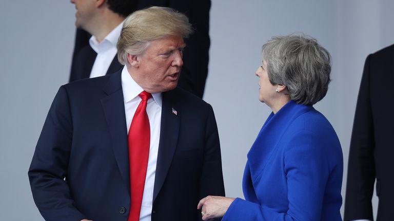 Donald Trump in discussion with Theresa May at the NATO Summit