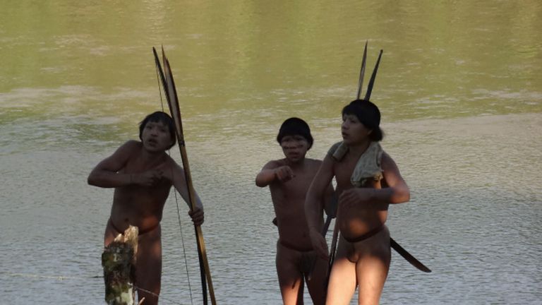 Three members of a previously uncontacted tribe make voluntary contact with a team of researchers from Funai