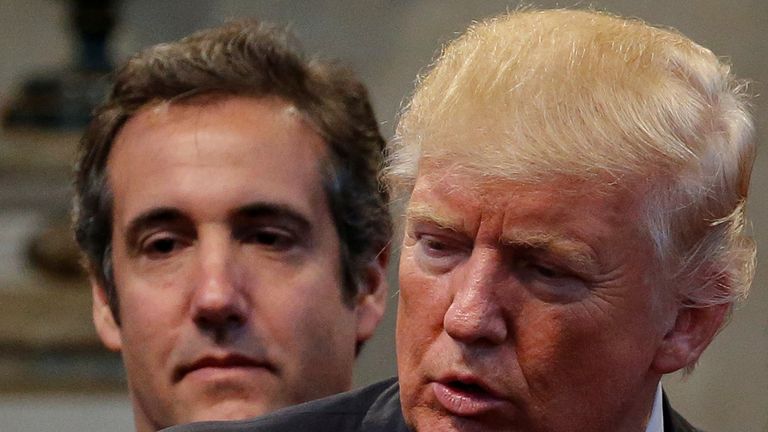 Republican presidential nominee Donald Trump&#39;s personal attorney Michael Cohen stands behind Trump as a group of supporters lay hands on Trump in prayer during a campaign stop at the New Spirit Revival Center church in Cleveland Heights, Ohio, U.S. September 21, 2016. Picture taken September 21, 2016. REUTERS/Jonathan Ernst