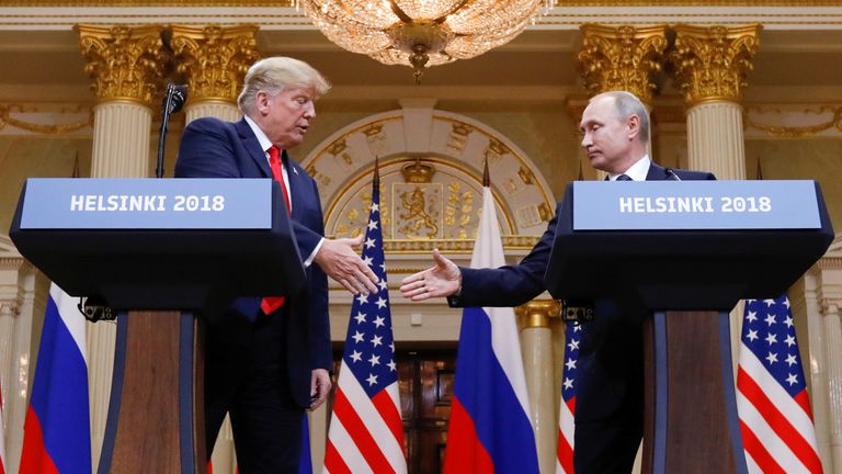 U.S. President Donald Trump and Russia's President Vladimir Putin shake hands during a joint news conference after their meeting in Helsinki, Finland, July 16, 2018