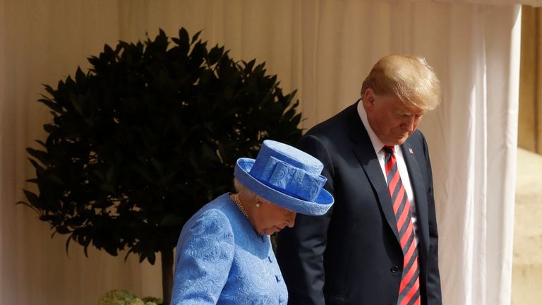 US President Donald Trump and Queen Elizabeth II prepare to inspect a Guard of Honour, formed of the Coldstream Guards, at Windsor Castle, Windsor