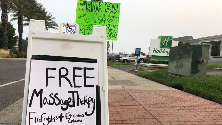 A resident of Redding offers free massage to firefighters