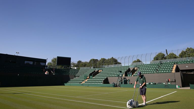 Wimbledon ground staff have said they are working hard to maintain the quality of the grass courts in the heat