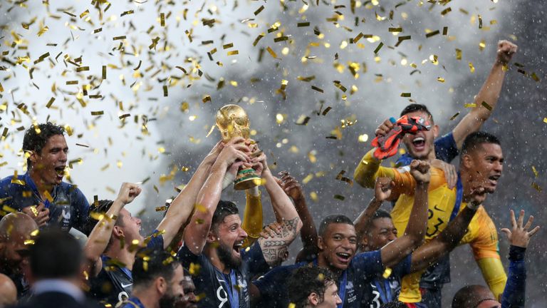 MOSCOW, RUSSIA - JULY 15: Olivier Giroud of France celebrates with the World Cup Trophy and his teammates following his sides victory in the 2018 FIFA World Cup Final between France and Croatia at Luzhniki Stadium on July 15, 2018 in Moscow, Russia. (Photo by Clive Rose/Getty Images)
