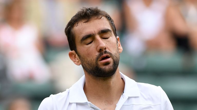 Croatia&#39;s Marin Cilic reacts against Argentina&#39;s Guido Pella during their men&#39;s singles second round match on the fourth day of the 2018 Wimbledon Championships at The All England Lawn Tennis Club in Wimbledon, southwest London, on July 5, 2018. 