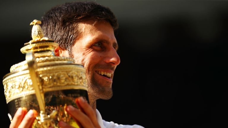 Novak Djokovic of Serbia celebrates with the trophy after winning the Men&#39;s Singles final against Kevin Anderson of South Africa on day thirteen of the Wimbledon Lawn Tennis Championships at All England Lawn Tennis and Croquet Club on July 15, 2018 in London, England.