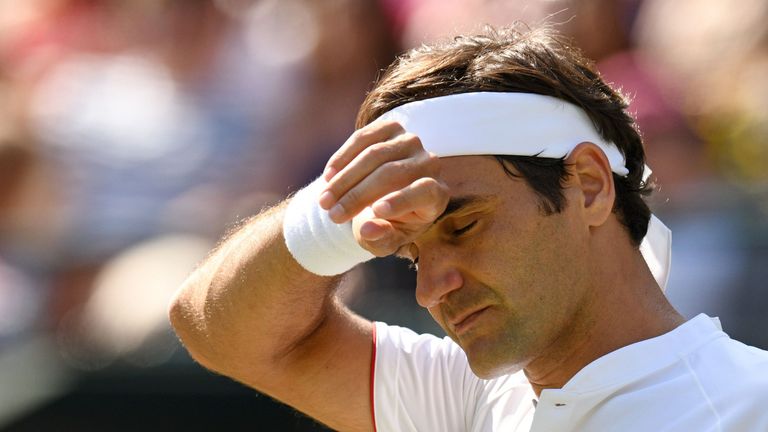 Switzerland&#39;s Roger Federer reacts against South Africa&#39;s Kevin Anderson during their men&#39;s singles quarter-finals match on the ninth day of the 2018 Wimbledon Championships at The All England Lawn Tennis Club in Wimbledon, southwest London, on July 11, 2018.