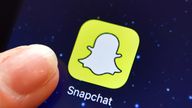 LONDON, ENGLAND - AUGUST 03: A finger is posed next to the Snapchat app logo on an iPad on August 3, 2016 in London, England. (Photo by Carl Court/Getty Images)  