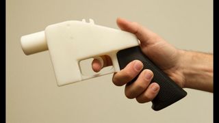 3D printed gun being held.