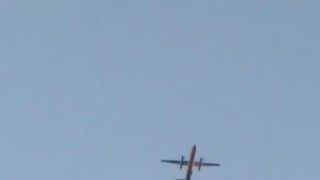 A Horizon Air Bombardier Dash 8 Q400, reported to be hijacked, flies over Fircrest, Washington, the U.S