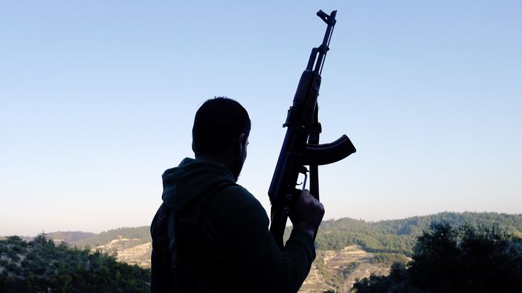 An armed rebel in the Syrian conflict. 